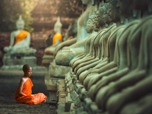 Young Buddhist Monk praying, Thailand