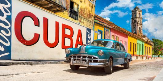 Vintage car and mural, Cuba
