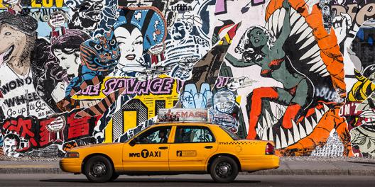 Taxi and mural painting in Soho, NYC