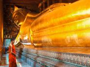 Praying the reclined Buddha, Wat Pho, Bangkok, Thailand